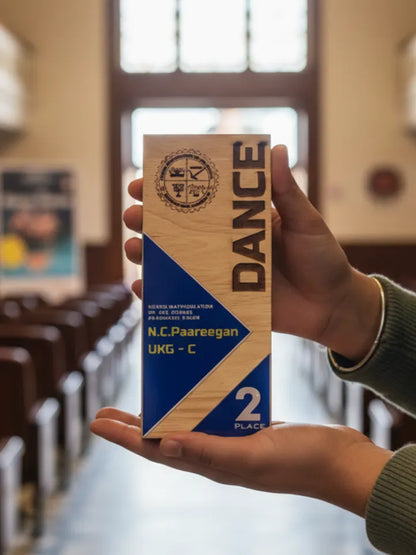 Hand holding a 'DANCE' product box in an indoor setting with blurred background