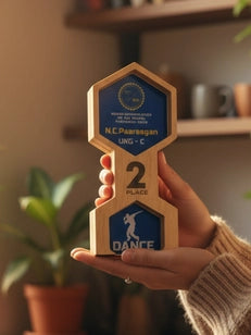 hand holding the dance trophy