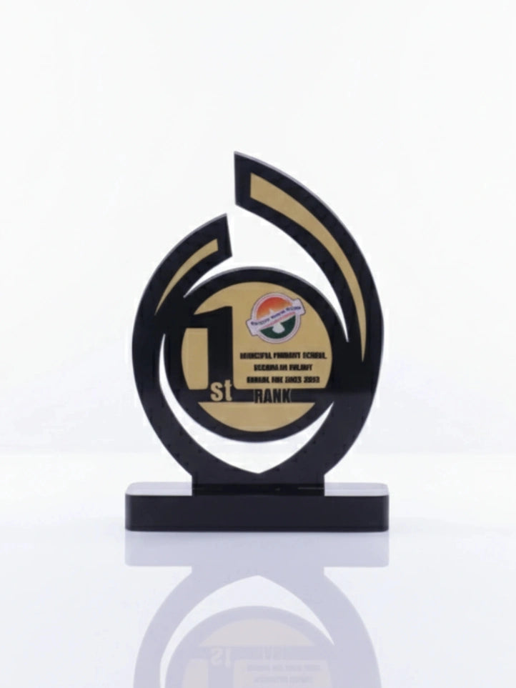 Decorative award with black and gold design on a white background