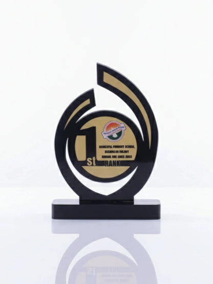 Decorative award with black and gold design on a white background