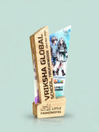 Wooden award with a printed design on a light blue background