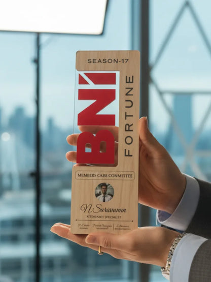 Hand holding a 'BNI Fortune' box with a blurred cityscape background
