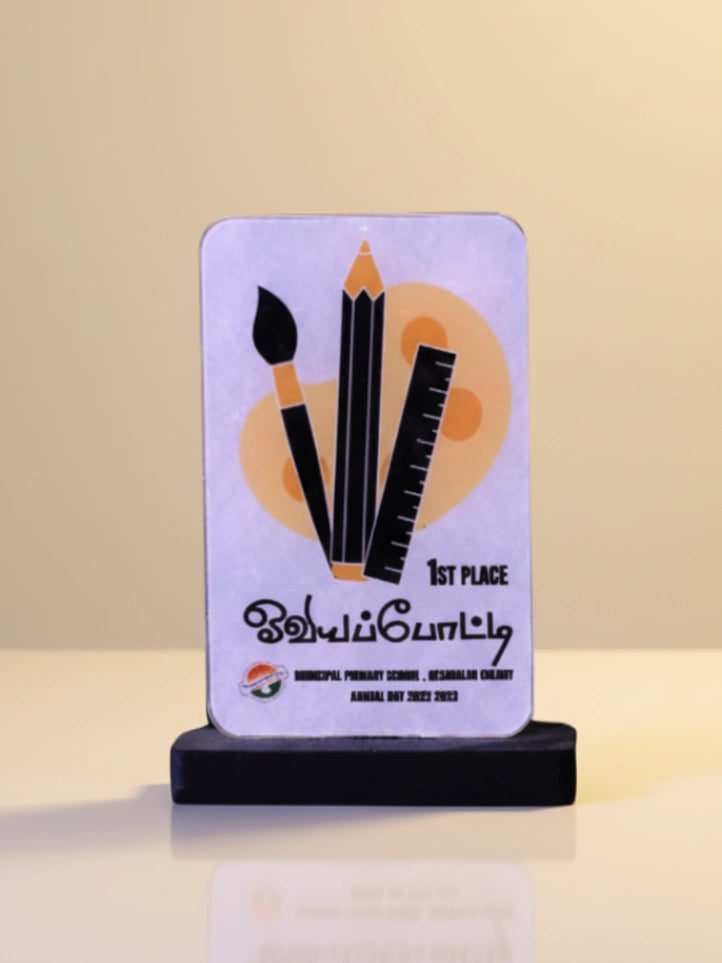 Award plaque with artistic design on a stand against a beige background