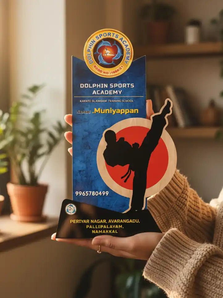 Person holding a branded product packaging for Dolphin Sports Academy in a home setting.