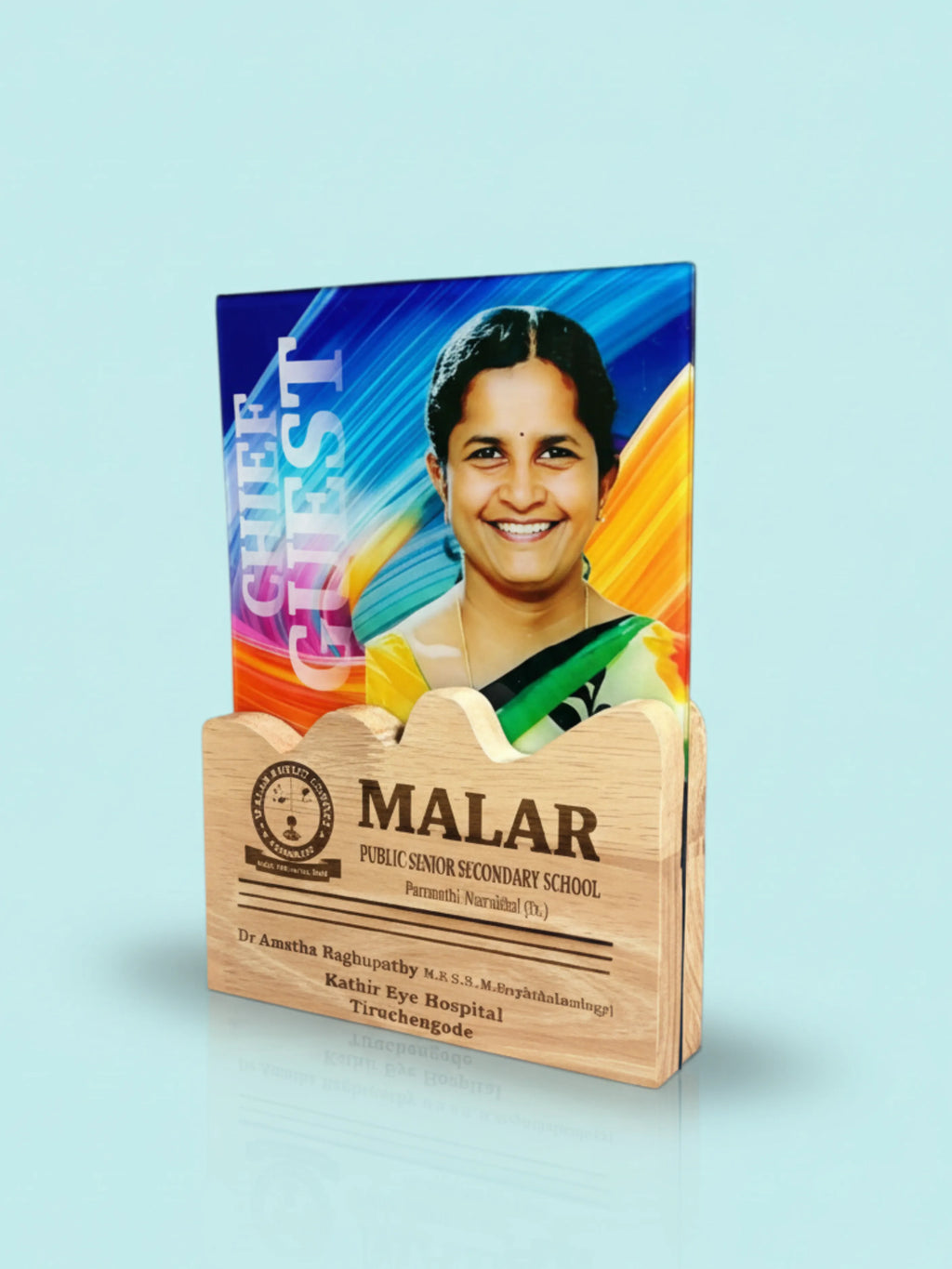 Acrylic plaque with a photo of a woman and engraved text on a light blue background