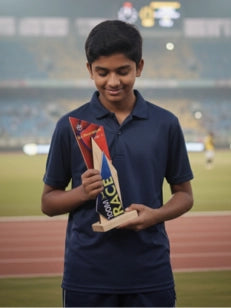 Person holding a trophy on a sports field