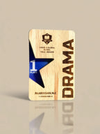 Wooden plaque with 'Drama' and '1st Place' text on a beige background
