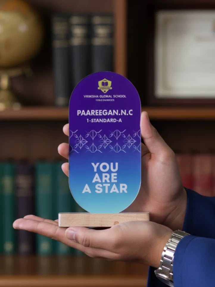 Person holding a personalized award with 'You Are a Star' message in front of a bookshelf.