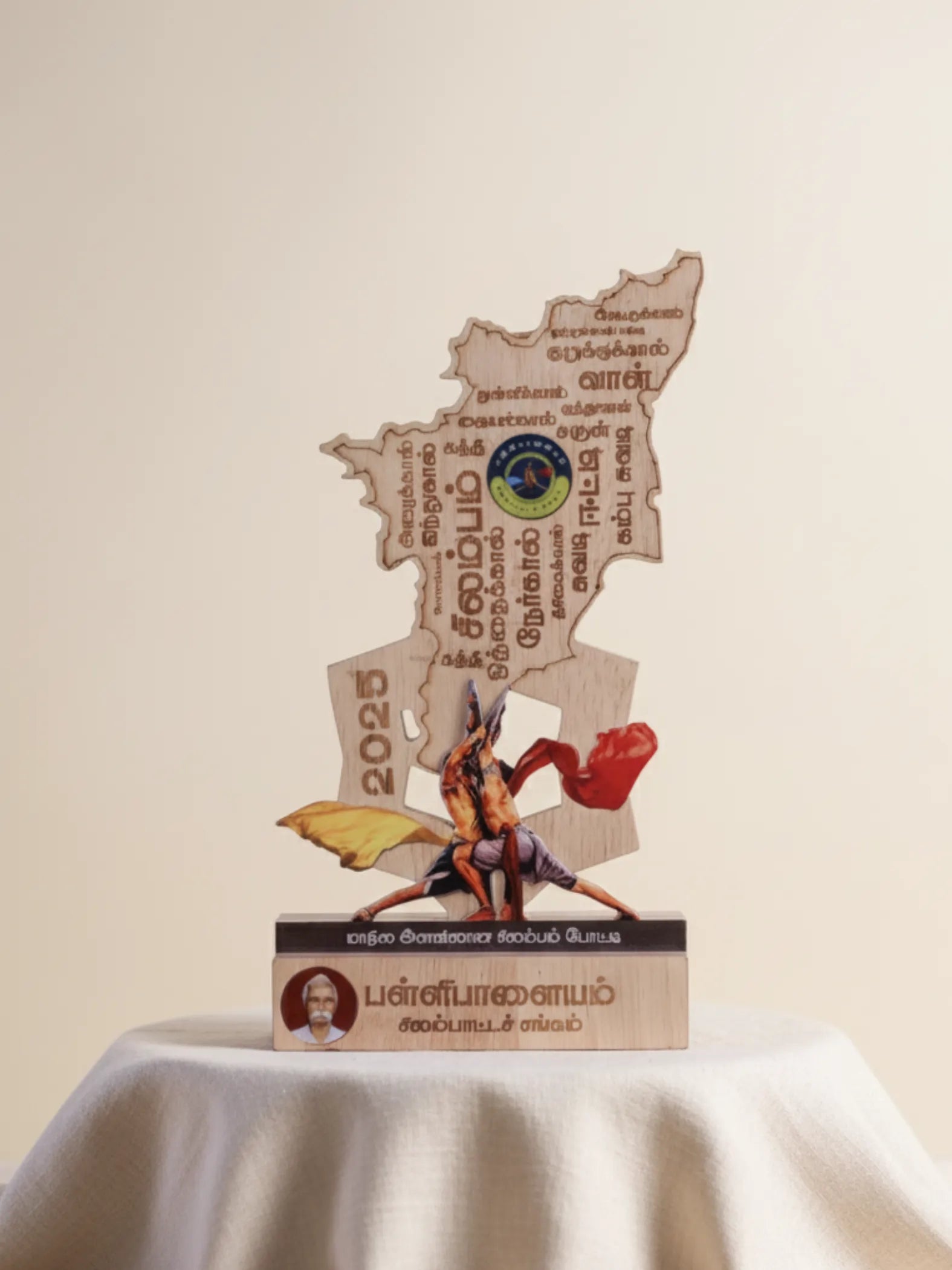 Decorative item with a map design and a figure on a white surface