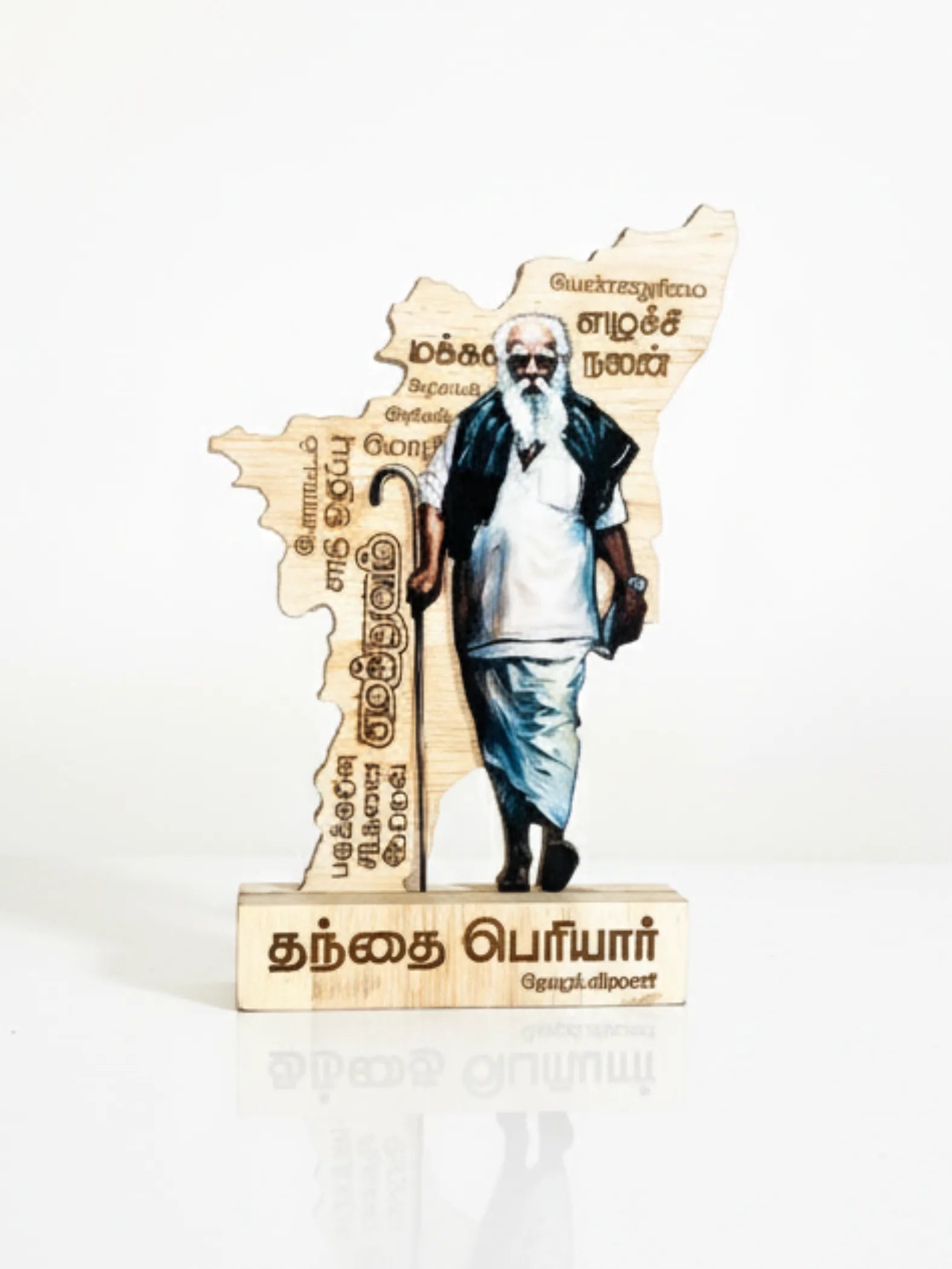 Wooden statue of a historical figure with text on a white background