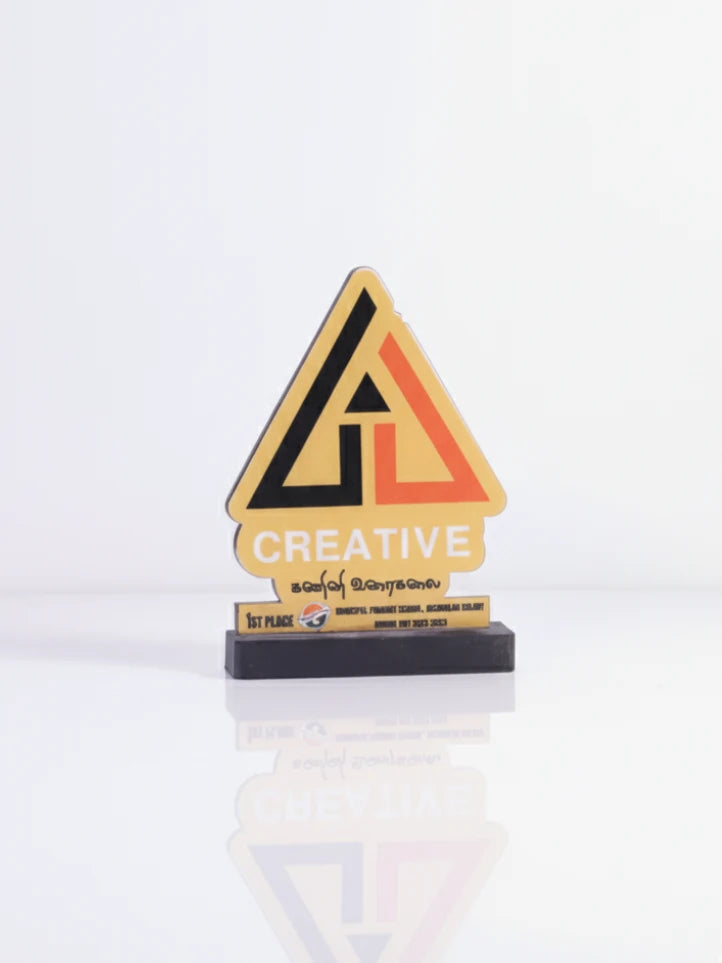 Triangular award with 'Creative' text on a white background