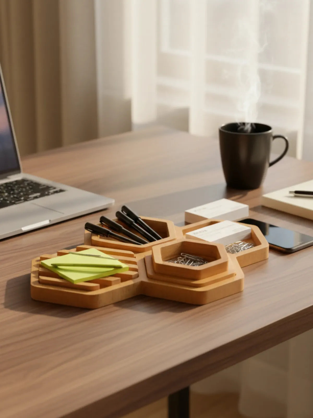 Wooden desk organizer with stationery items on a wooden desk.