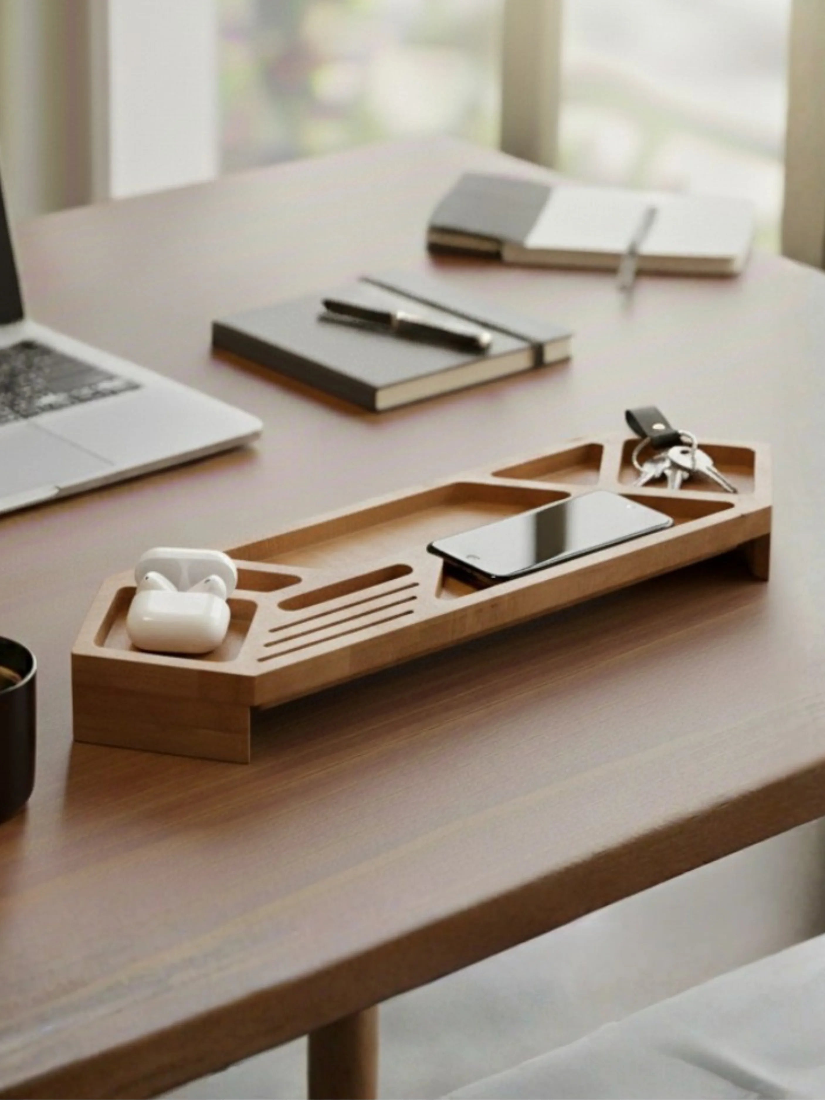 Wooden desk organizer tray with phone, tablet and electronic devices on modern office desk - natural wood finish