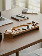 Wooden desk organizer tray with phone, tablet and electronic devices on modern office desk - natural wood finish