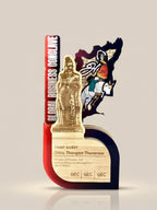 Decorative award with a gold figure and text on a beige background