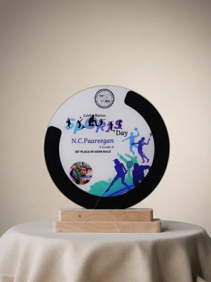 Circular trophy with sports-themed design on a beige background