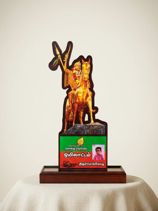 Decorative item with a figure on a horse and a green and red base on a white surface.
