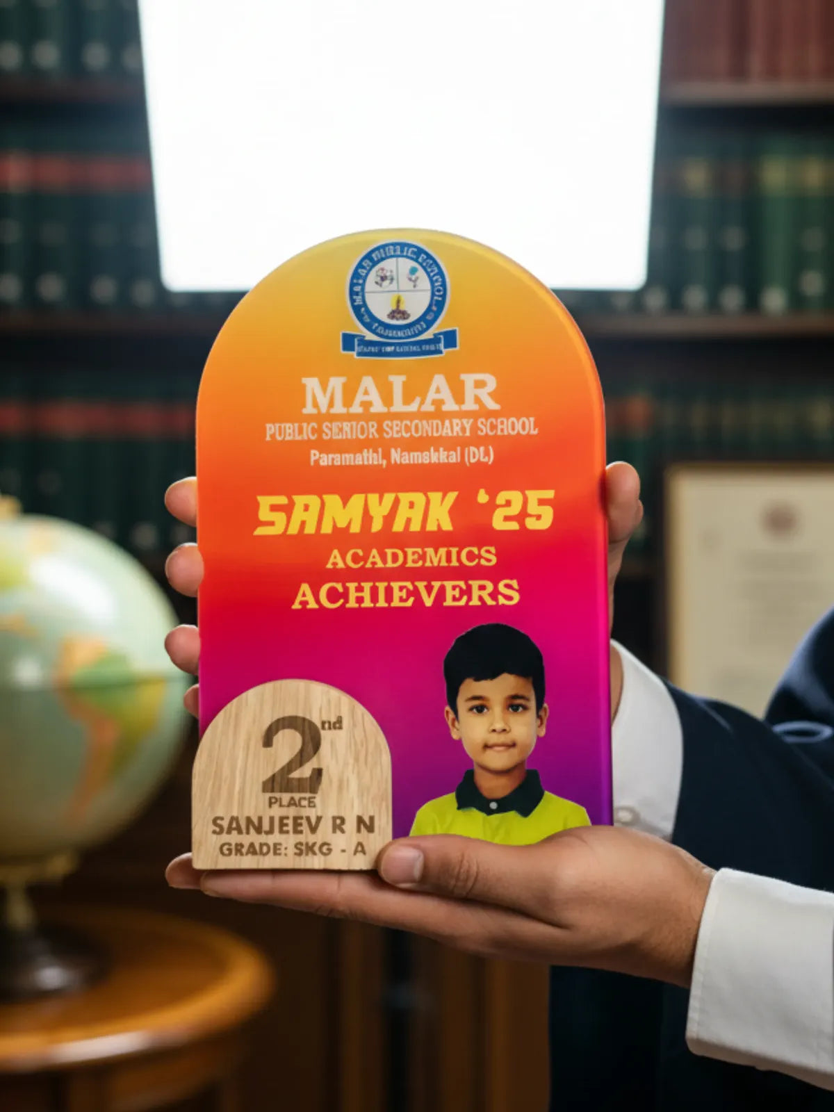 Academic achievement award for Malar Public School with a child's photo and details.