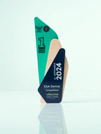 Trophy with green and blue design, featuring 'ESA Dance Competition' and 'Vriksha Global School' on a light gray background.