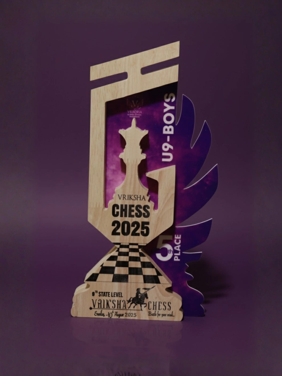 Chess tournament trophy for U9 Boys with 'Vriksha Chess 2025' on a purple background