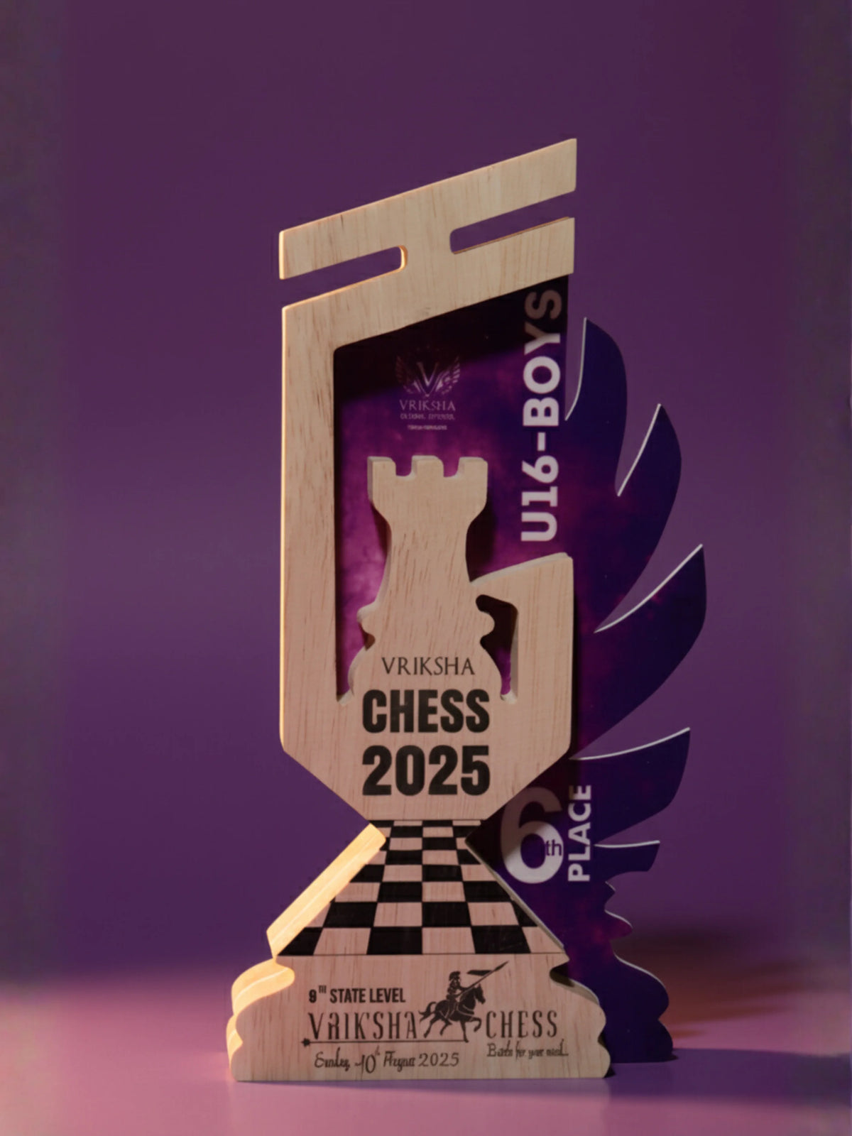 Chess trophy with 'Vriksha Chess 2025' branding on a purple background