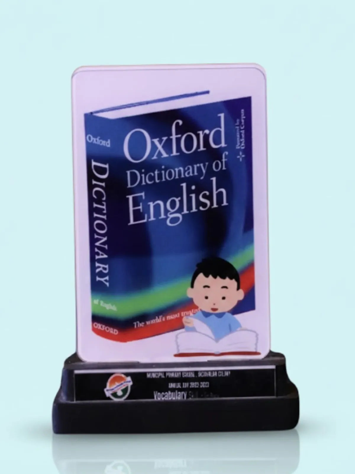 Oxford Dictionary of English on a stand with a light blue background