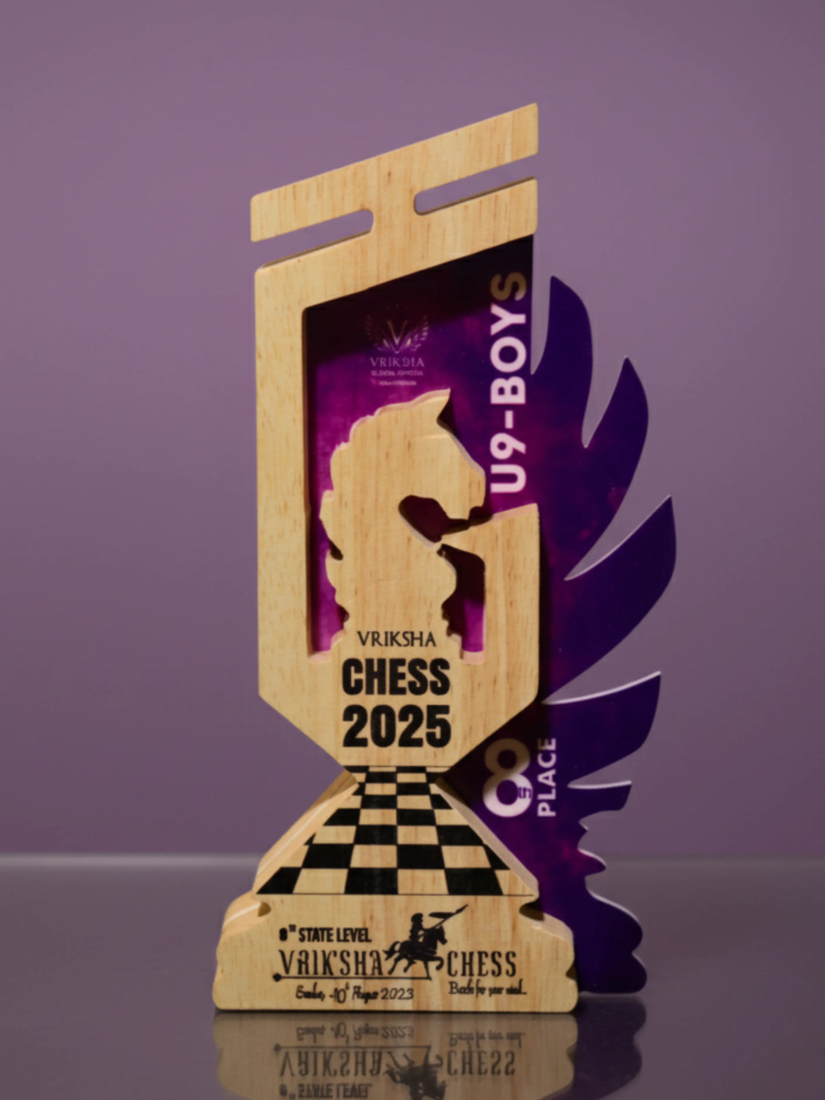 Wooden chess trophy with purple accents on a reflective surface against a purple background