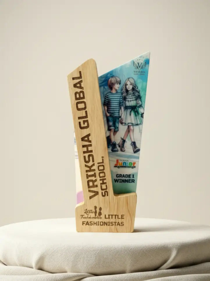 Trophy with 'Vriksha Global School' and 'Little Fashionistas' branding on a neutral background