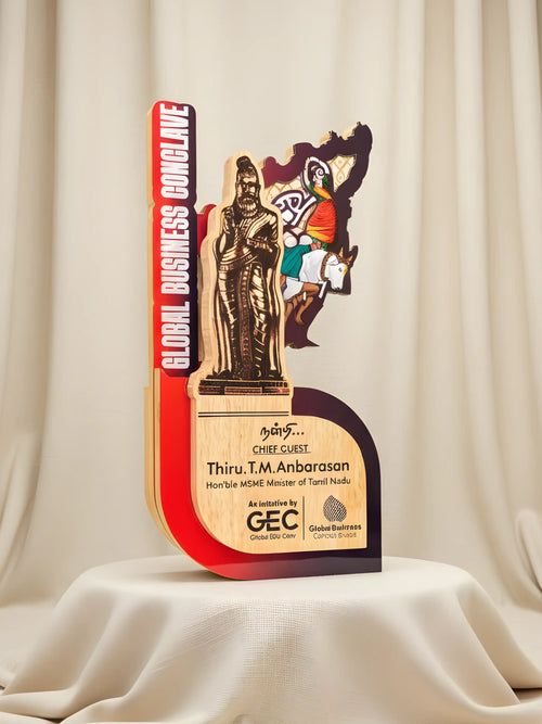 Decorative award with statues on a beige curtain background