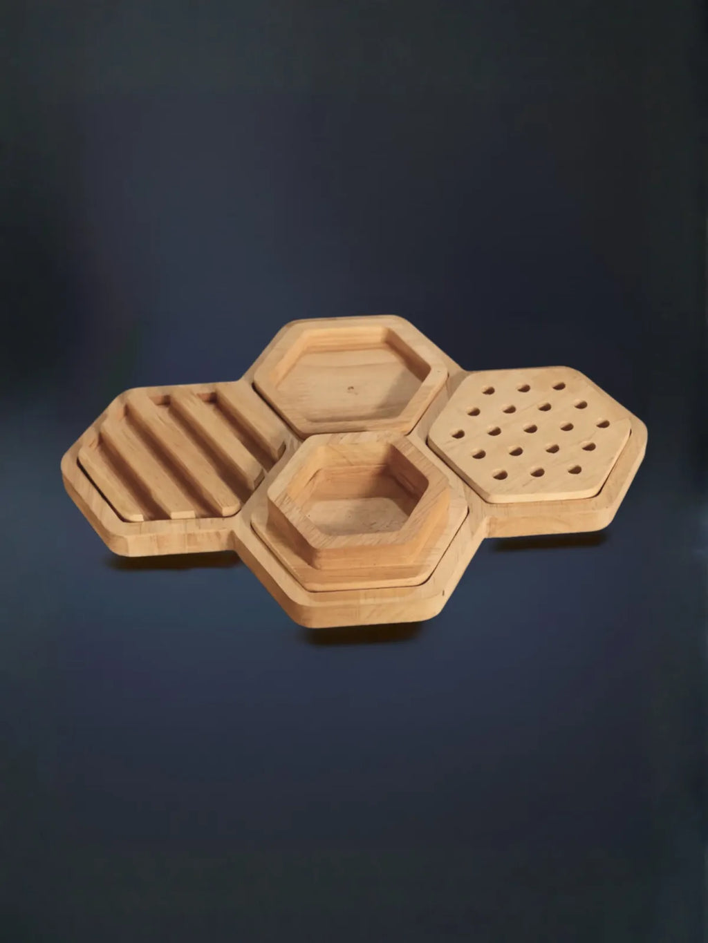 Hexagonal wooden trays with different patterns on a dark background