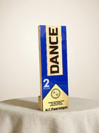 Box with 'DANCE' branding on a neutral background