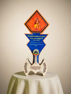 Decorative award with colorful design on a beige background