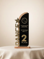 Side view of Cultural Day Best Dance Trophy showing crystal base and golden award figurine