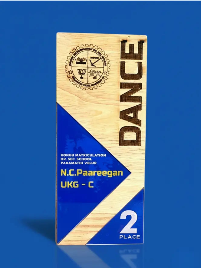 Wooden plaque with 'DANCE' and award details on a blue background