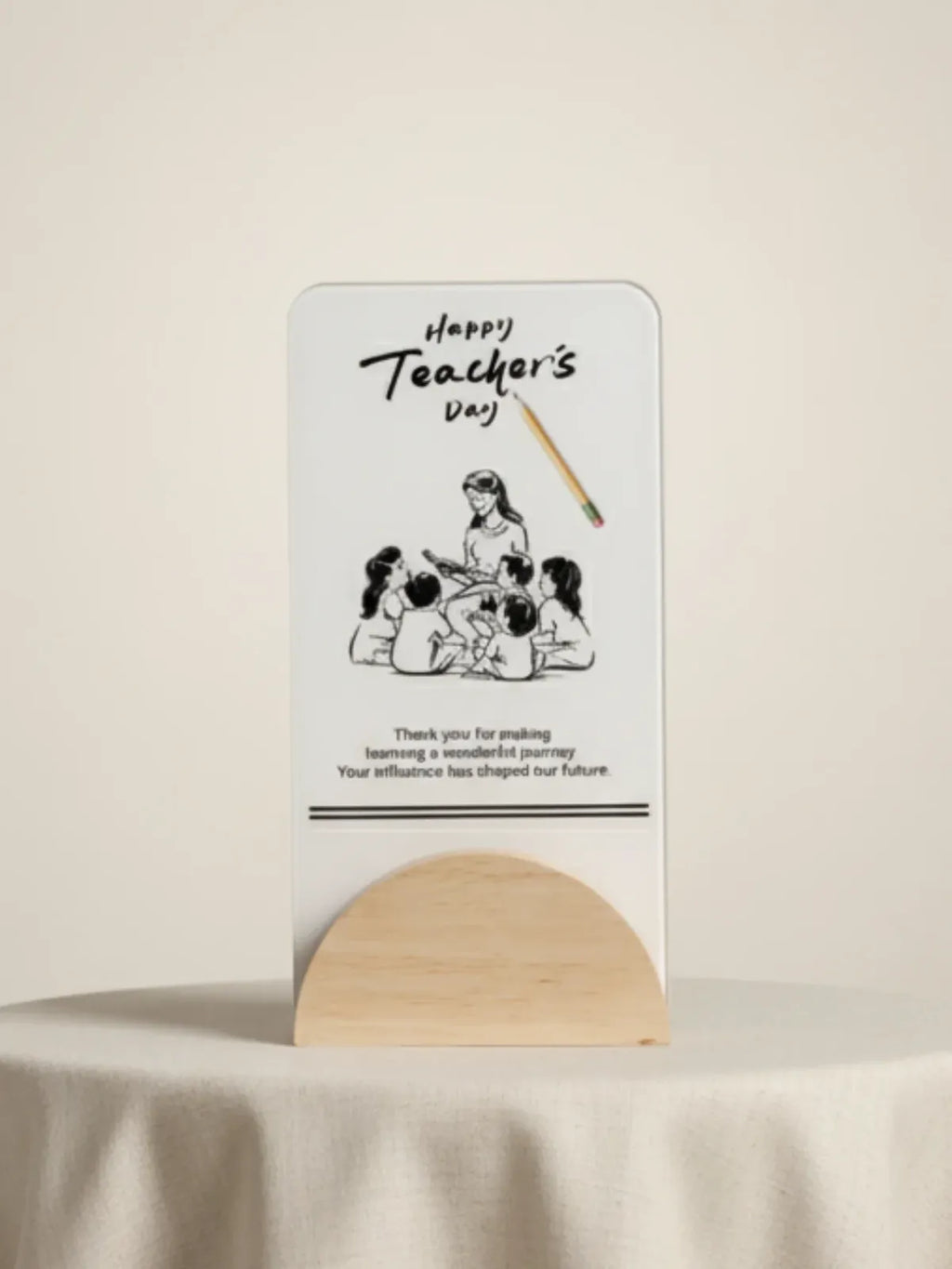 Card with illustration of children and teacher, text 'Happy Teacher's Day', on a stand against a beige background.
