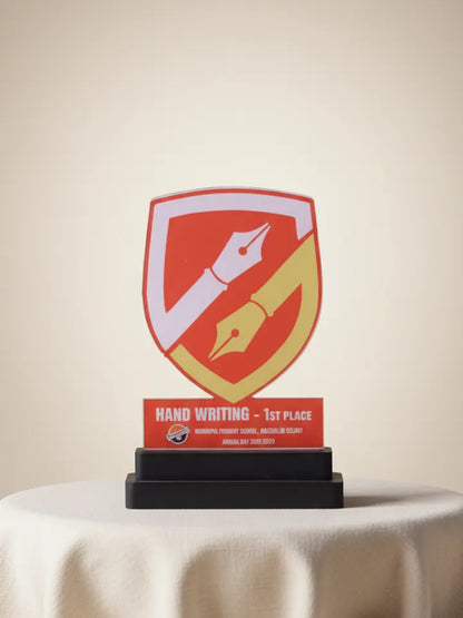 Trophy with a red and yellow design on a white tablecloth