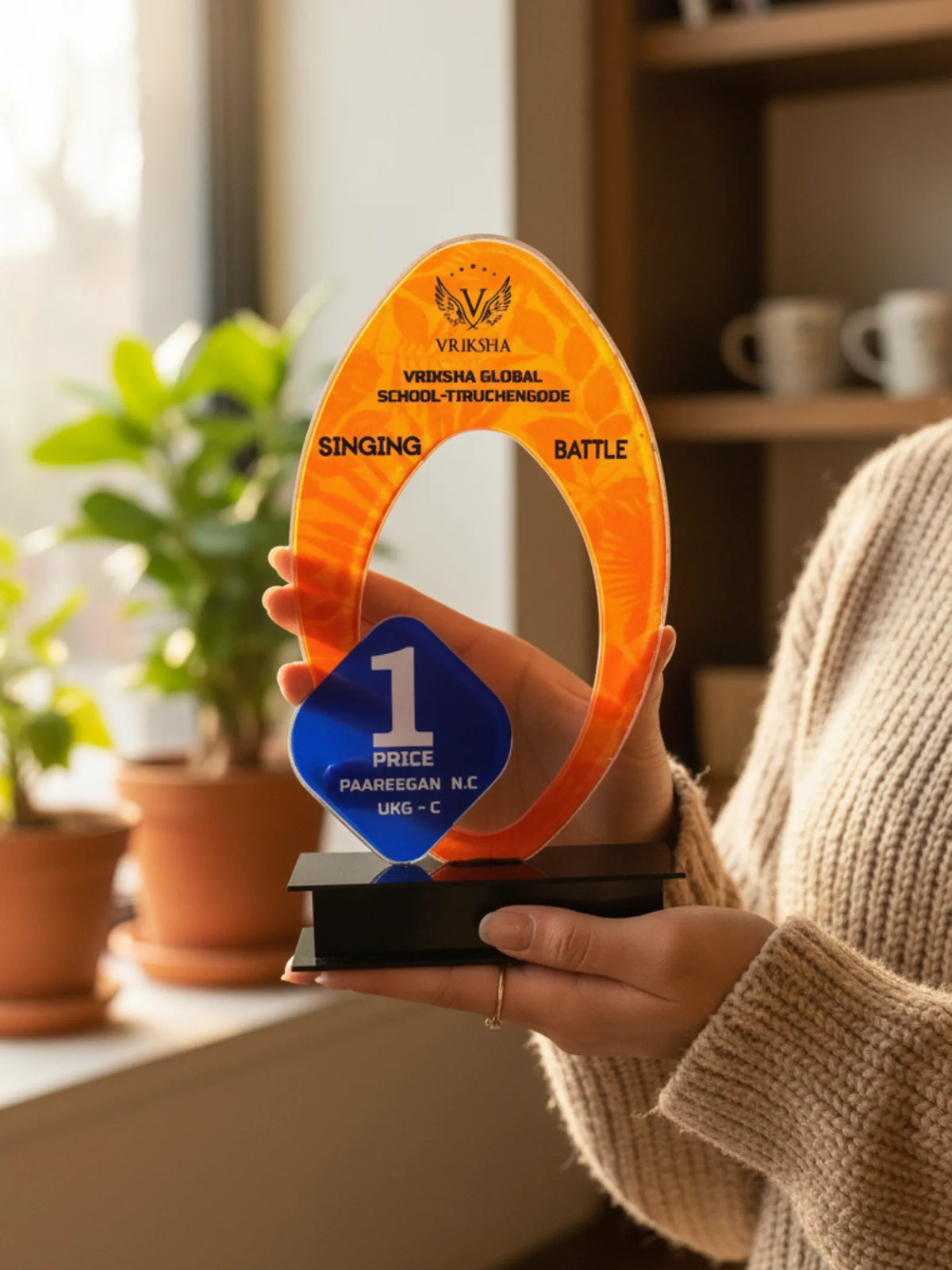 Singing trophy shield for academic music award - elegant golden shield with musical note design for vocal competitions