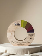 Wooden award with GEC logo and color wheel on a beige background
