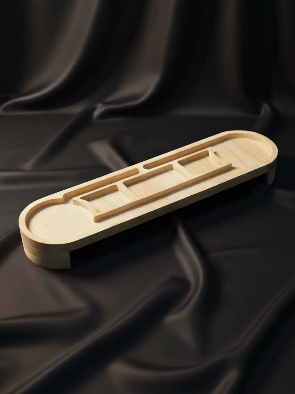 Wooden puzzle on a black fabric background