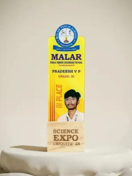 Award plaque for a science expo with a person's photo and text on a white background