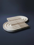 Close-up of personalized pen holder and phone stand showing custom name engraving detail