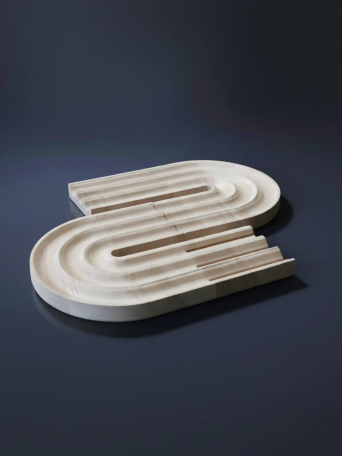 Close-up of personalized pen holder and phone stand showing custom name engraving detail