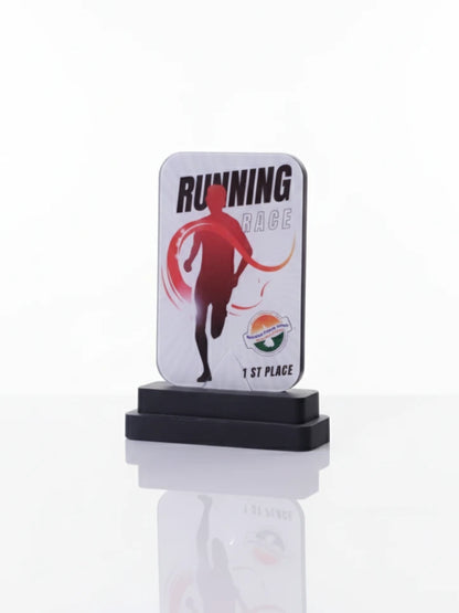 Running race trophy with a white base and black top on a white background