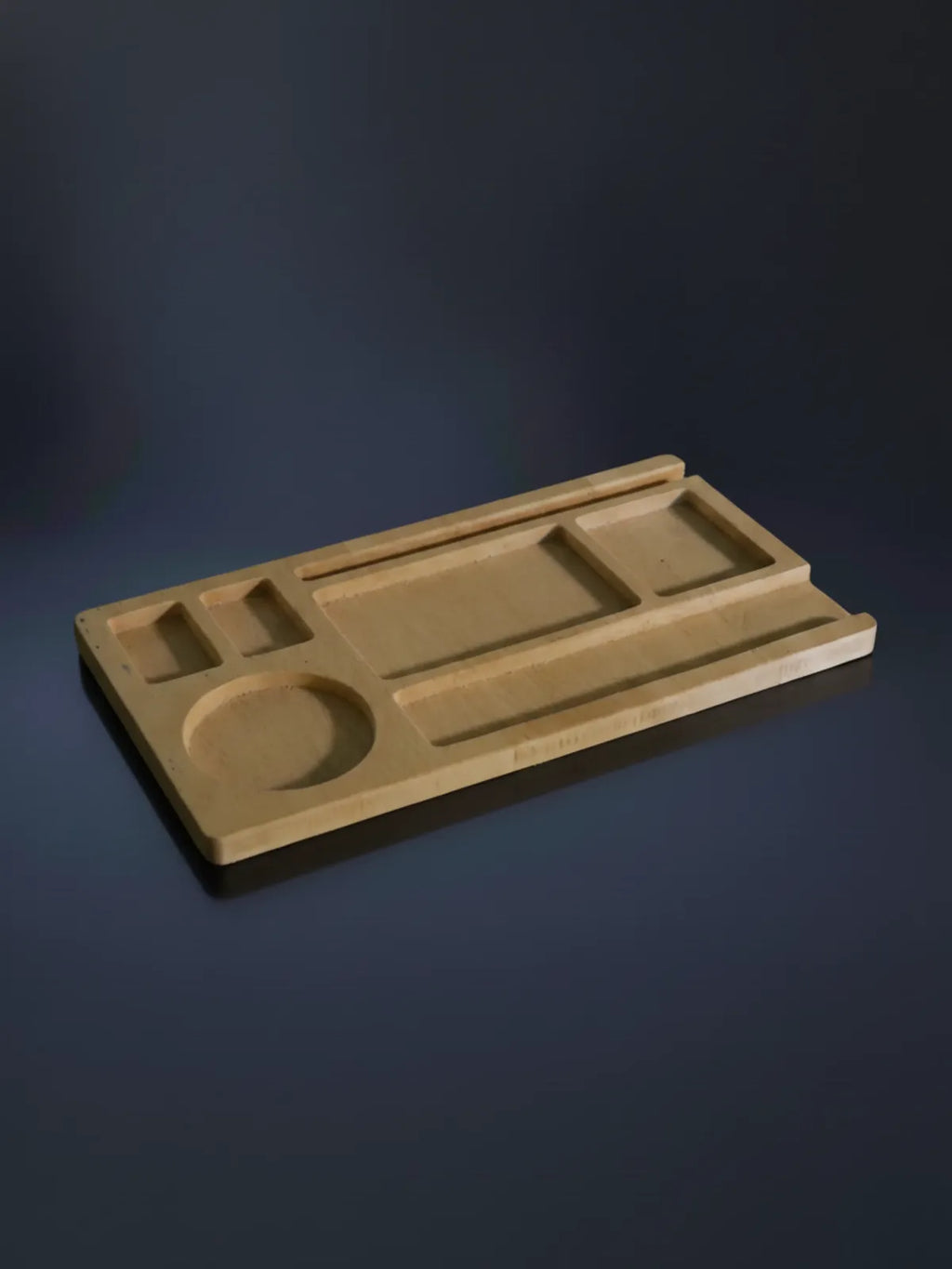 Wooden tray with geometric compartments on a gray blue satin background