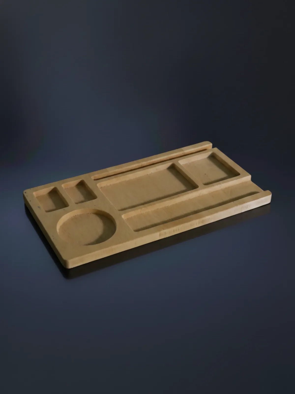 Wooden tray with geometric compartments on a gray blue satin background