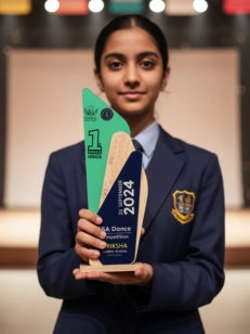 Person in a school uniform holding an award with '2024' on it, standing in front of a blurred background.