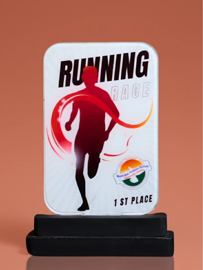 Running race trophy with a silhouette of a runner on a white base against an orange background