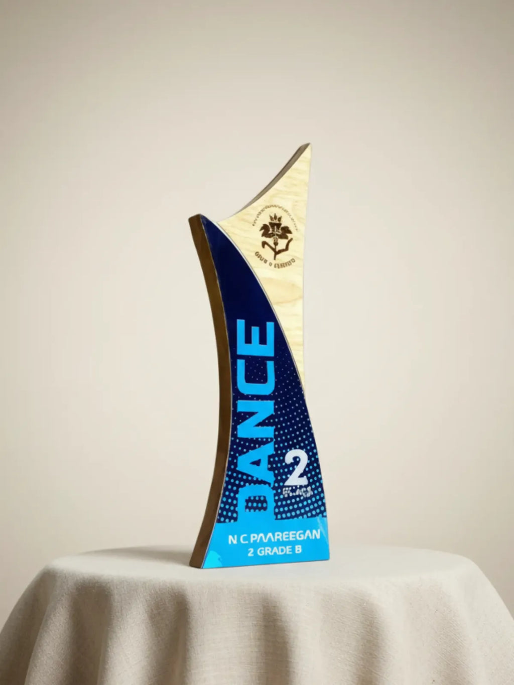 Tennis racket with blue and brown design on a light gray background