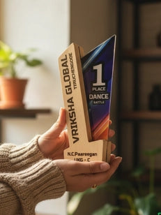 Hand holding two products with visible branding in an indoor setting