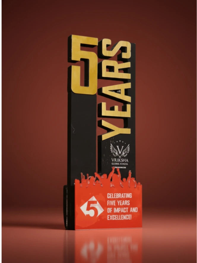 Trophy celebrating five years of impact and excellence with 'Vishwa Global Schools' branding on a brown background.